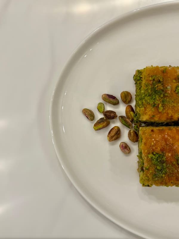 Pistachio baklava on a white plate